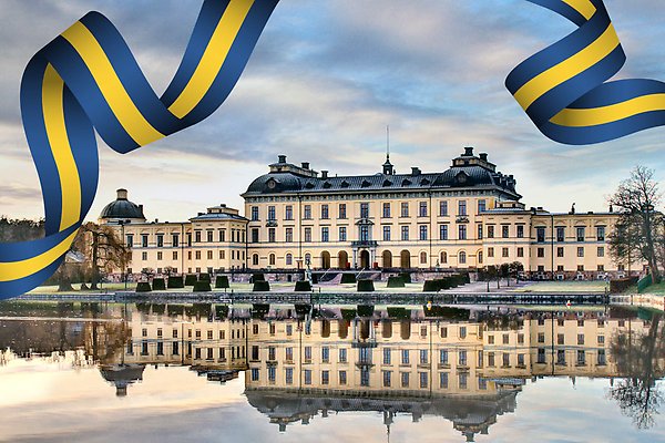Drottningholms slott med en banderoll i svenska flaggans färger.